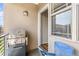 Outdoor patio featuring a grill, with an exterior view and plenty of natural light at 8073 W 51St Pl # 303, Arvada, CO 80002