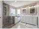 Modern bathroom with a walk-in shower, soaking tub, and double vanity at 5168 Rocky Mountain Dr, Castle Rock, CO 80109