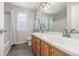 Bathroom features a double vanity, bright lighting, and a shower/tub combo with a privacy curtain at 5168 Rocky Mountain Dr, Castle Rock, CO 80109