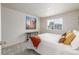 Bedroom with large artwork, lots of sunlight, wooden table and stylish pillows at 5168 Rocky Mountain Dr, Castle Rock, CO 80109