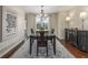 Dining room showcasing a dark wood table, decorative buffet, and stylish rug at 5168 Rocky Mountain Dr, Castle Rock, CO 80109