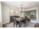 Formal dining room featuring a wooden table set, chandelier, and hardwood floors at 5168 Rocky Mountain Dr, Castle Rock, CO 80109