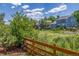 Peaceful property with a fenced yard and mature trees under a bright sky at 5168 Rocky Mountain Dr, Castle Rock, CO 80109