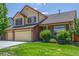 Charming two-story home with brick accents and a well-manicured lawn at 5168 Rocky Mountain Dr, Castle Rock, CO 80109
