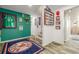 Hallway with sports memorabilia, leading to carpeted stairs and finished basement at 5168 Rocky Mountain Dr, Castle Rock, CO 80109