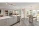 Bright kitchen area with stainless steel appliances, modern cabinets, and an adjacent dining area at 5168 Rocky Mountain Dr, Castle Rock, CO 80109
