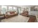 Spacious living room featuring ample seating, bright natural light, and open-concept layout at 5168 Rocky Mountain Dr, Castle Rock, CO 80109