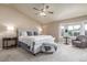 Main bedroom with a neutral color palette, bay window, and ceiling fan at 5168 Rocky Mountain Dr, Castle Rock, CO 80109