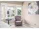 Bedroom sitting area with a bay window and comfortable gray chair at 5168 Rocky Mountain Dr, Castle Rock, CO 80109
