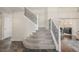 Elegant staircase with iron railings and plush carpeting at 5168 Rocky Mountain Dr, Castle Rock, CO 80109