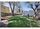 Spacious backyard with green lawn and mature trees, perfect for recreation at 1817 - 1821 Vine Vine St, Denver, CO 80206