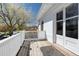 Balcony with white brick and a wooden deck, offering an outdoor space and neighborhood views at 1817 - 1821 Vine Vine St, Denver, CO 80206
