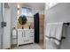Modern bathroom with updated vanity, round mirror, and tile shower at 1817 - 1821 Vine Vine St, Denver, CO 80206
