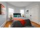 Inviting bedroom with hardwood floors, soft lighting, and curated wall art enhancing the serene ambiance at 1817 - 1821 Vine Vine St, Denver, CO 80206