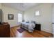 Bright bedroom with natural light, hardwood floors, and a daybed perfect for relaxation at 1817 - 1821 Vine Vine St, Denver, CO 80206