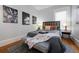 Comfortable bedroom with natural light and stylish decor. Artwork and matching lamps enhance the room's appeal at 1817 - 1821 Vine Vine St, Denver, CO 80206