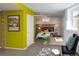 Bedroom/office featuring exposed brick accents, neutral colors, and plenty of room to relax or work at 1817 - 1821 Vine Vine St, Denver, CO 80206
