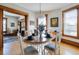 Dining room with wood floors, a round table set for four, and decorative art at 1817 - 1821 Vine Vine St, Denver, CO 80206