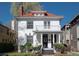 Beautiful home with red tile roof, white exterior, and inviting front porch at 1817 - 1821 Vine Vine St, Denver, CO 80206