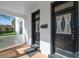 Charming front porch with double doors with lace curtains and new welcome mat at 1817 - 1821 Vine Vine St, Denver, CO 80206
