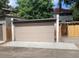 Attached garage with new brick and door at 1817 - 1821 Vine Vine St, Denver, CO 80206