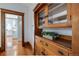 Hallway featuring hardwood floors, vintage built-in cabinet and view to the kitchen at 1817 - 1821 Vine Vine St, Denver, CO 80206