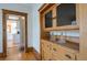 Hallway with wood floors, wood trim and built-in cabinet storage at 1817 - 1821 Vine Vine St, Denver, CO 80206