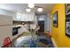 Quaint eat-in kitchen featuring white cabinets, colorful decor, and plenty of counter space at 1817 - 1821 Vine Vine St, Denver, CO 80206