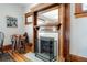 Living room fireplace with decorative wood trim, mirror, and ornate detail at 1817 - 1821 Vine Vine St, Denver, CO 80206