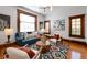 Bright living room with colorful rug, wood trim, and comfortable seating at 1817 - 1821 Vine Vine St, Denver, CO 80206