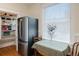 Pantry with shelving adjacent to a stainless steel refrigerator and small table at 1817 - 1821 Vine Vine St, Denver, CO 80206