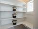 Walk-in pantry featuring shelving with ample space for storage, and natural light from a window at 1817 - 1821 Vine Vine St, Denver, CO 80206
