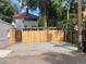 Parking area featuring a new fence and rock covering at 1817 - 1821 Vine Vine St, Denver, CO 80206