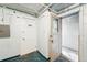 Basement doors leading to laundry and storage at 1422 Ivy St, Denver, CO 80220
