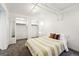 Bright bedroom with large closet and simple decor, featuring neutral carpet and white-painted walls at 1422 Ivy St, Denver, CO 80220