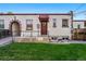 Front yard with the front door and arched brick detail at 1422 Ivy St, Denver, CO 80220