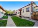 Street view of the house with a sidewalk, small front yard, and visible building number at 1422 Ivy St, Denver, CO 80220