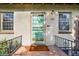 Inviting front entrance with a decorative door, sconce lighting, and a charming 'Hello' welcome mat at 1422 Ivy St, Denver, CO 80220