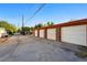 Perspective shot of multiple white-door garages, offering secure parking and storage solutions at 1422 Ivy St, Denver, CO 80220