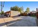 View of a multi-car garage featuring a textured wall and ample parking space at 1422 Ivy St, Denver, CO 80220