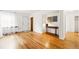 Bright and spacious living room with hardwood floors and white walls, offering a clean and modern aesthetic at 1422 Ivy St, Denver, CO 80220