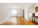 Bright living room with hardwood floors and white walls, offering a clean and modern aesthetic at 1422 Ivy St, Denver, CO 80220