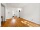 Bright living room with hardwood floors, white walls, and arched doorways for a modern feel at 1422 Ivy St, Denver, CO 80220