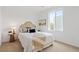 Bright bedroom with a queen bed, stylish headboard, and large window at 8711 E Hampden Ave # 21, Denver, CO 80231