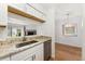 Updated kitchen featuring stainless steel appliances, granite counters, and view to the dining area at 3600 S Pierce St # 1-104, Lakewood, CO 80235