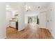 Open floor plan with kitchen access, living area and sliding glass doors to the exterior at 3600 S Pierce St # 1-104, Lakewood, CO 80235