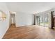 Spacious living room with wood floors, natural light, and a stone fireplace at 3600 S Pierce St # 1-104, Lakewood, CO 80235