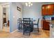 Cozy eat-in kitchen space with wood table set and adjacent to the kitchen at 2682 S Cathay Way # 307, Aurora, CO 80013