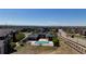 Beautiful community pool surrounded by lush landscape and mountain views on a sunny day at 2682 S Cathay Way # 307, Aurora, CO 80013