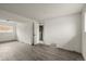 Bright basement with wood-look floors and neutral walls showcasing a clean, adaptable space at 16325 E Alabama Dr, Aurora, CO 80017